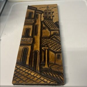 Hand-carved signed wooden relief panel depicting European village architecture